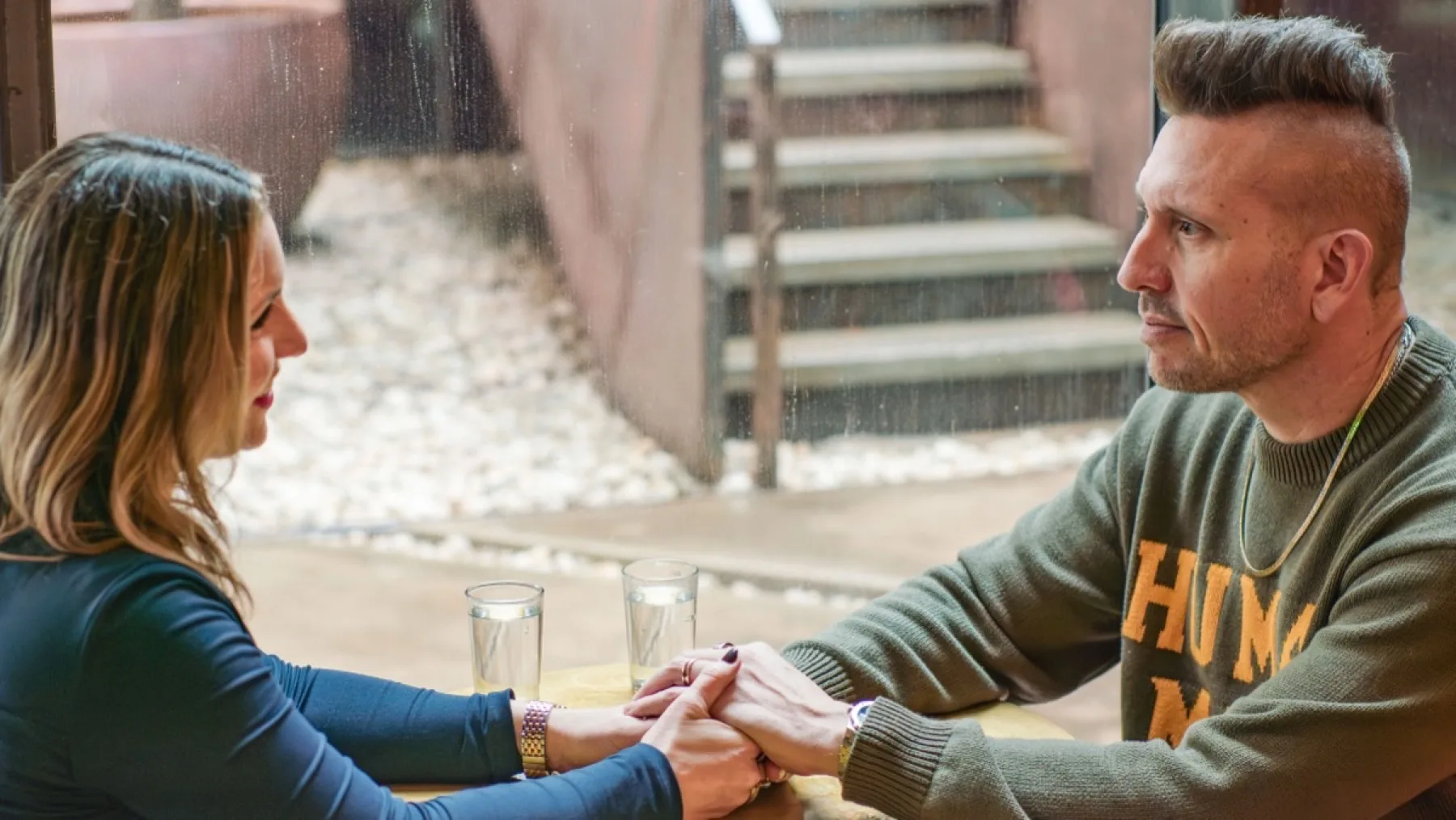 Joshua and Rachel — holding hands